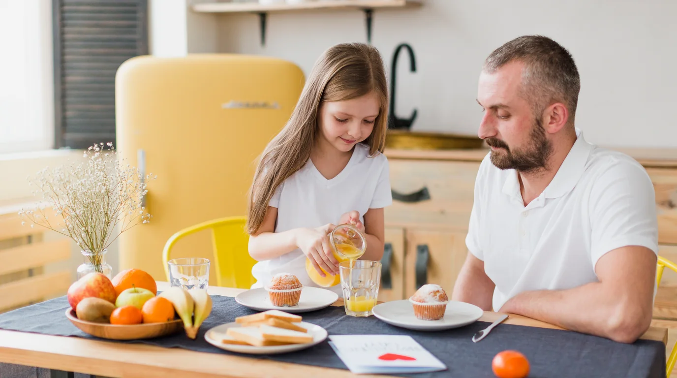 Happy multi-generation family having healthy breakfast together at dining table