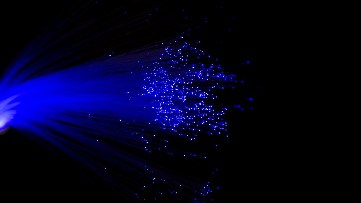 Macro detail of illuminated optical fiber cable bundle illustrating covert fiber-optic endoscope probes