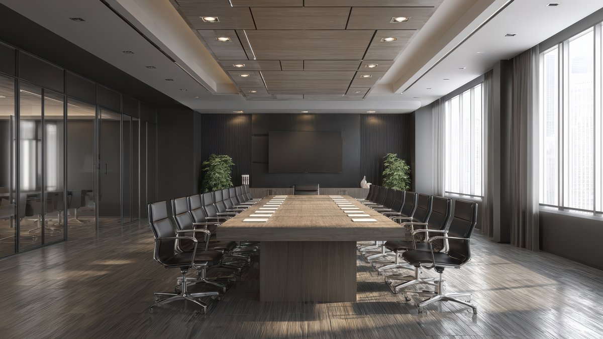 Modern corporate boardroom with large conference table and presentation screens under counter-surveillance sweep