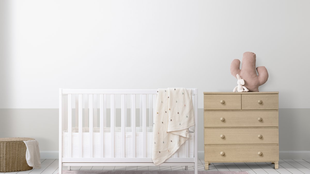 White infant crib in cozy modern nursery room under cybersecurity and privacy audit