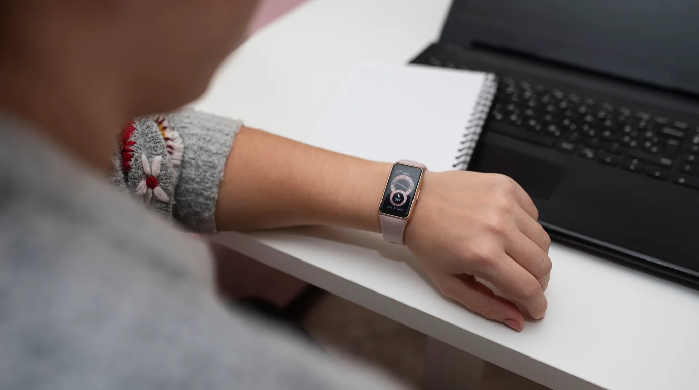 Apple Watch placed on a modern nightstand beside a charging station