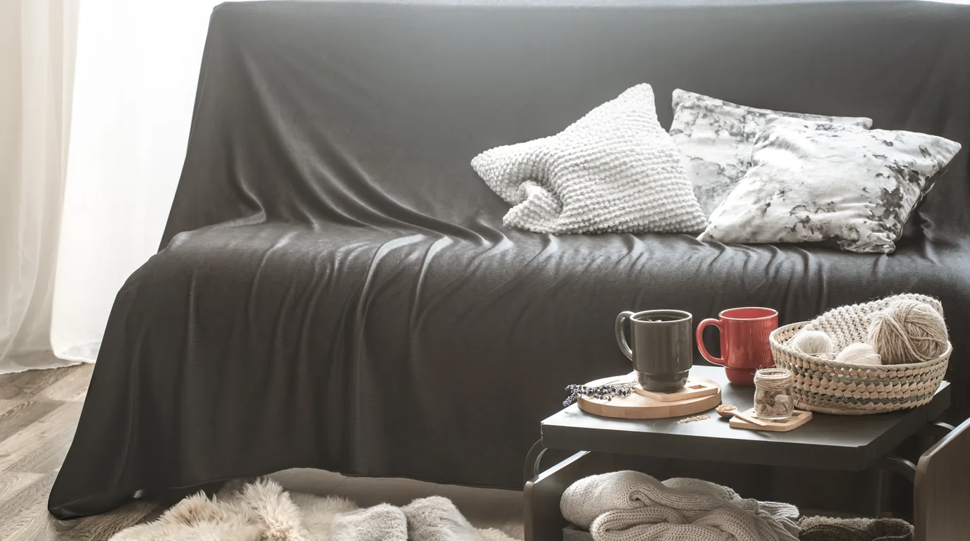 Plush living room sofa with deep cushions where small styluses easily slip out of sight
