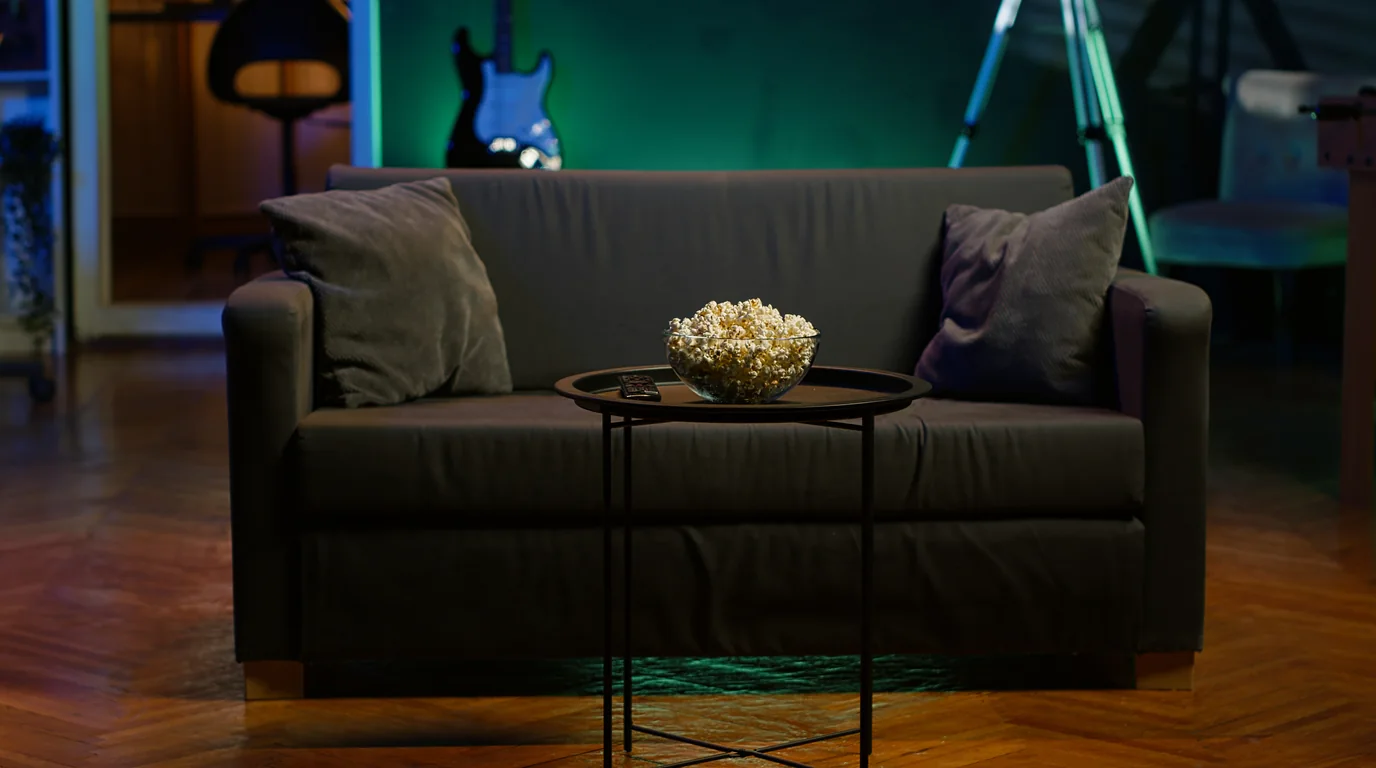 Living room sofa and coffee table where slim streaming remotes easily slide out of sight