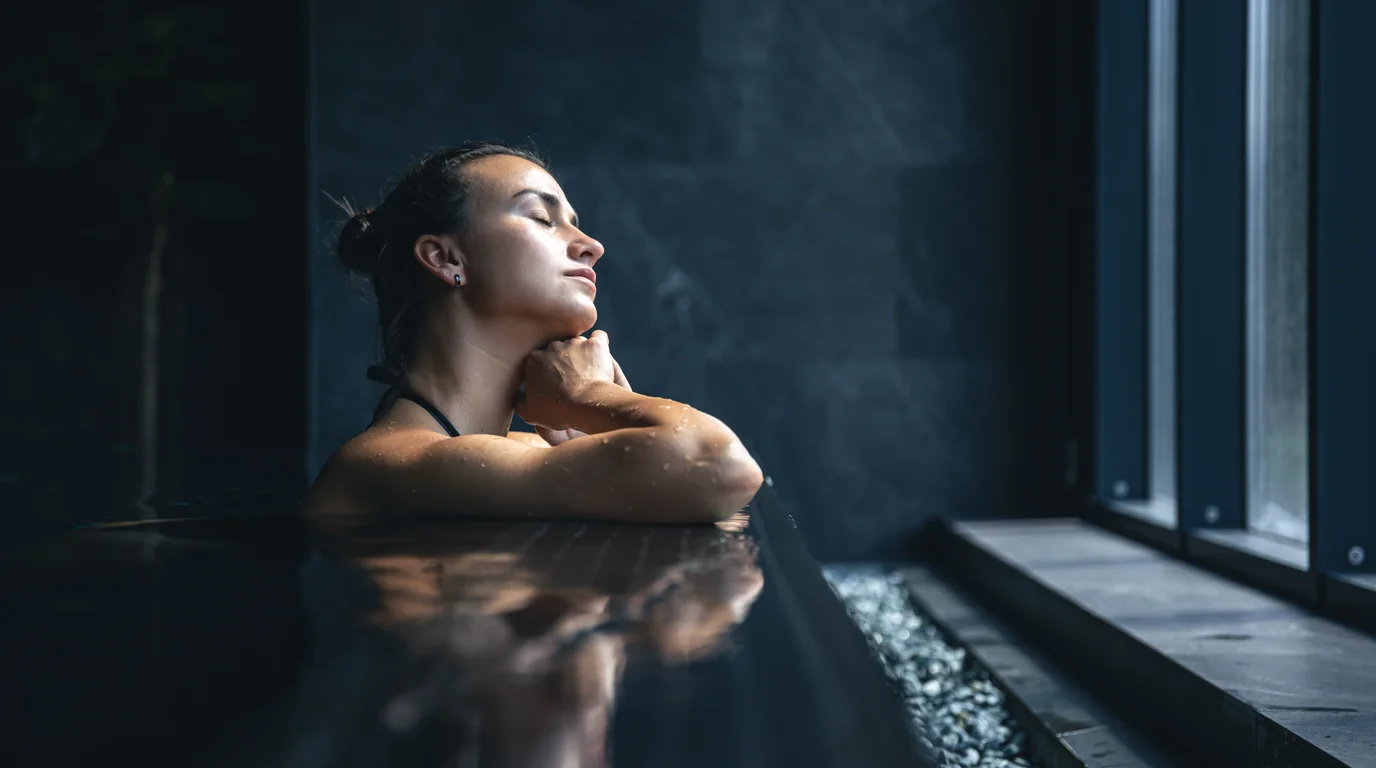 Nordic wellness spa with hot wooden sauna and adjacent cold plunge tub
