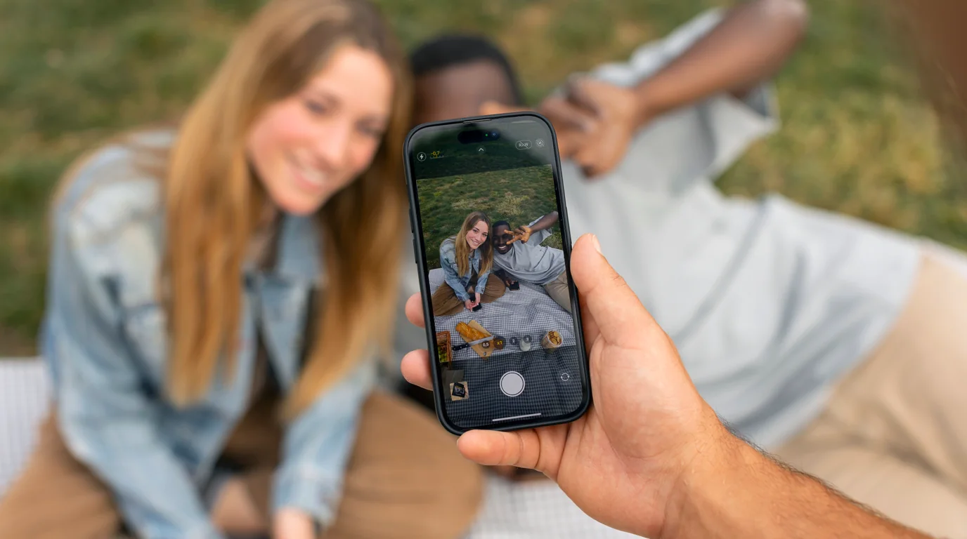 Close-up of fingers swiping smoothly across photos on a bright smartphone display